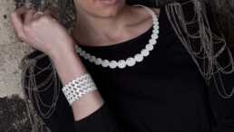 white pearl bangle and progression collier necklace